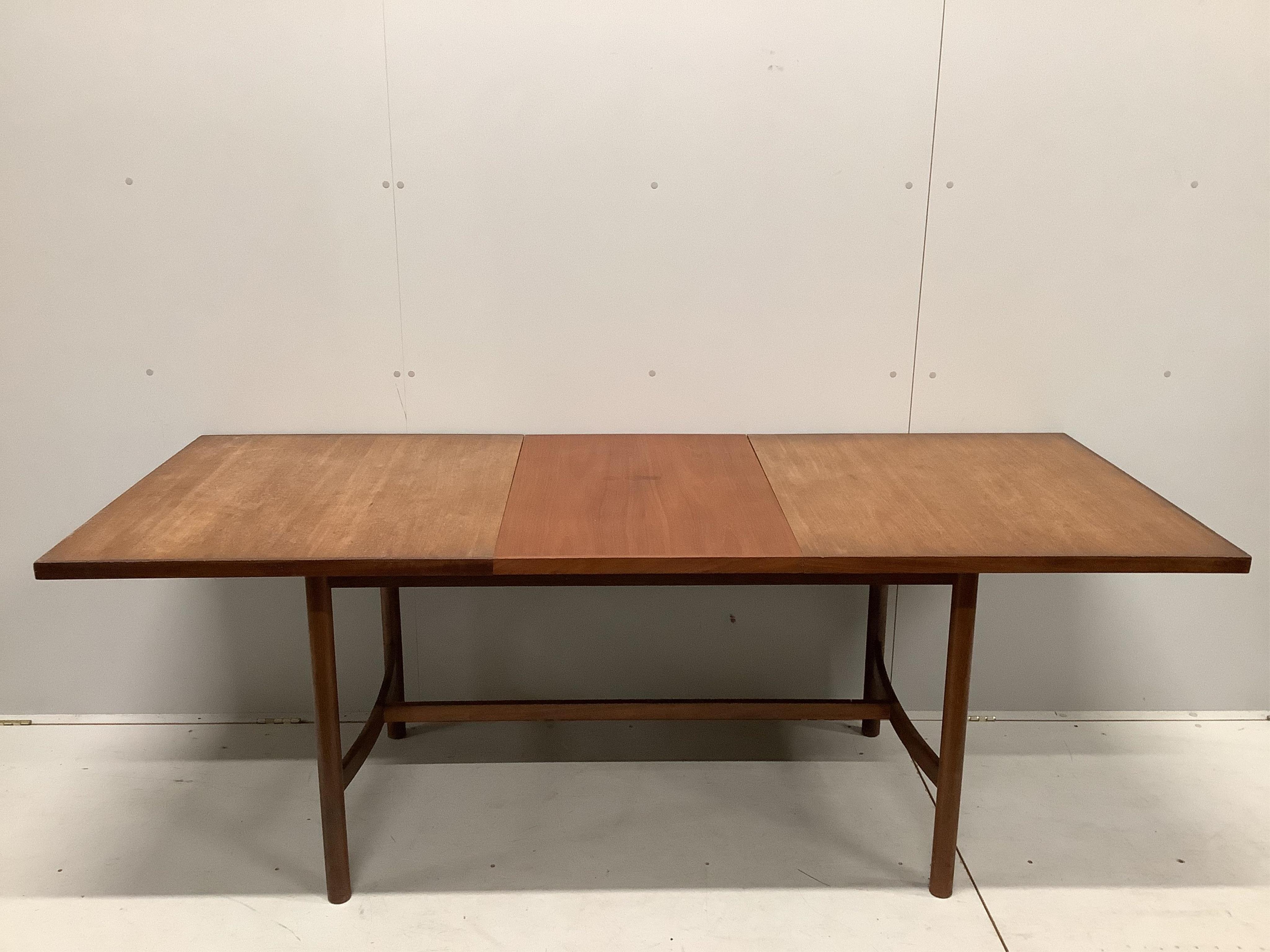 A mid century Meredew Furniture rectangular teak extending dining table and six chairs, table 206cm extended, one spare leaf, depth 84cm, height 75cm. Condition - fair.